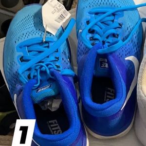Size 8, blue Nike, running track shoes. Worn.